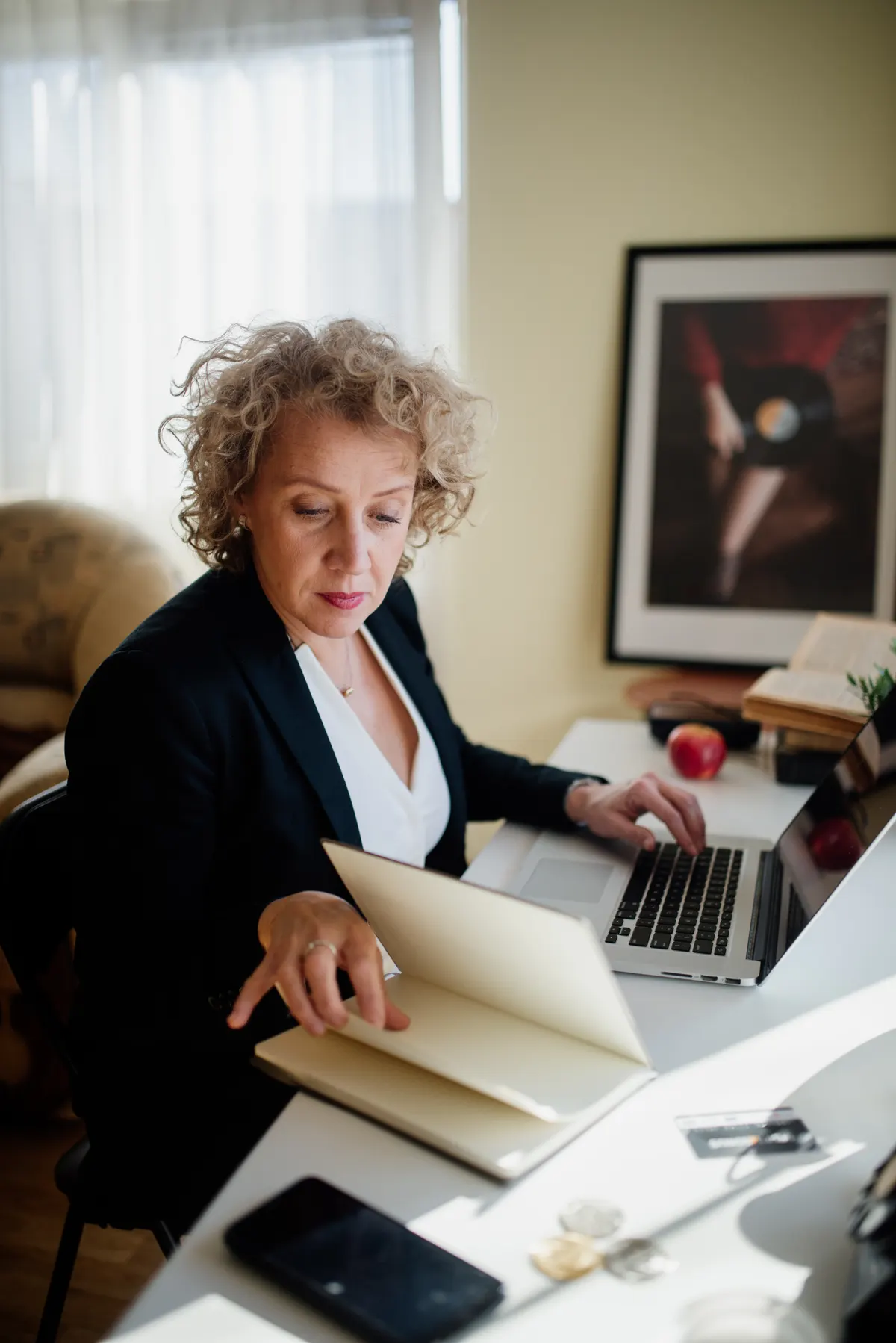 A claims handler reviewing documents