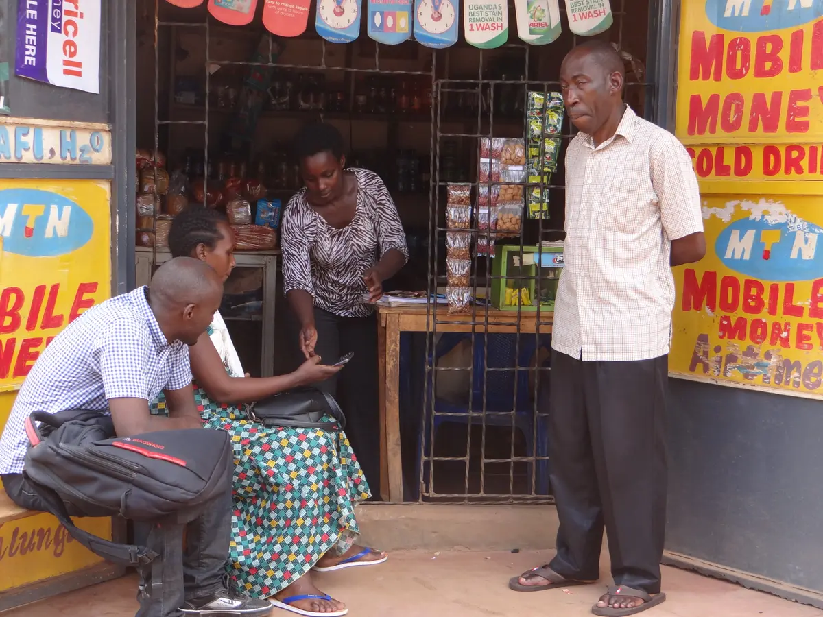 A person making a mobile money payment